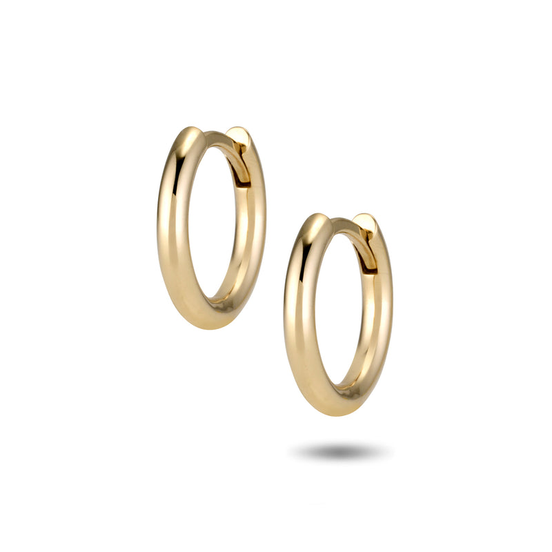 The TREASURE Huggie Hoops in Yellow Gold